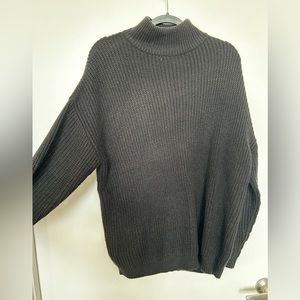 Black sweater, turtleneck.